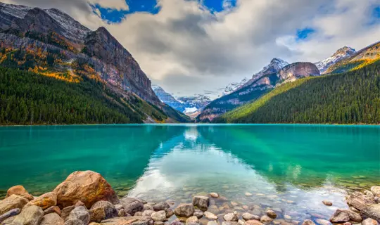 A panoramic view of Lake Louise with mountains in the background